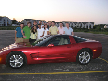 Group photo around Deb's Corvette